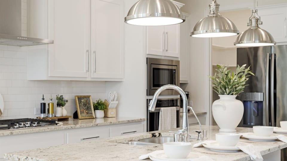 Thoughtfully designed kitchen with unique touches: a farmhouse-style chicken faucet, built-in trash compactor with push-button convenience, a soap dispenser pump, and filtered water right at the sink. perfect for comfortable stay.