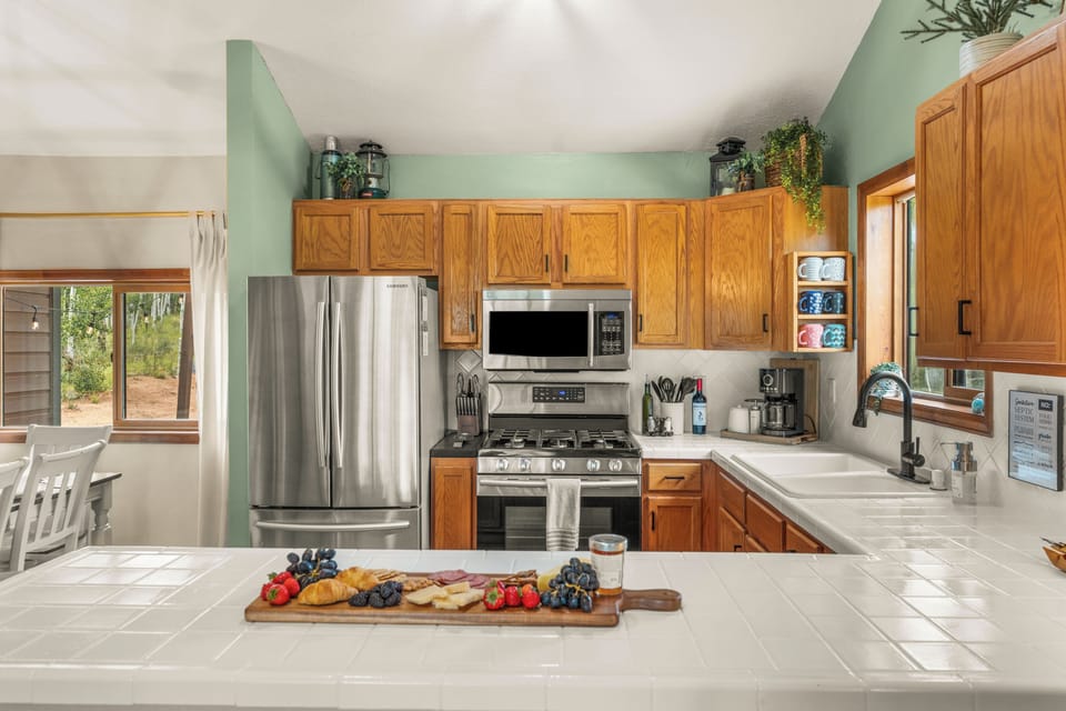 Fully equipped kitchen with spices, appliances, and room for sous chefs!