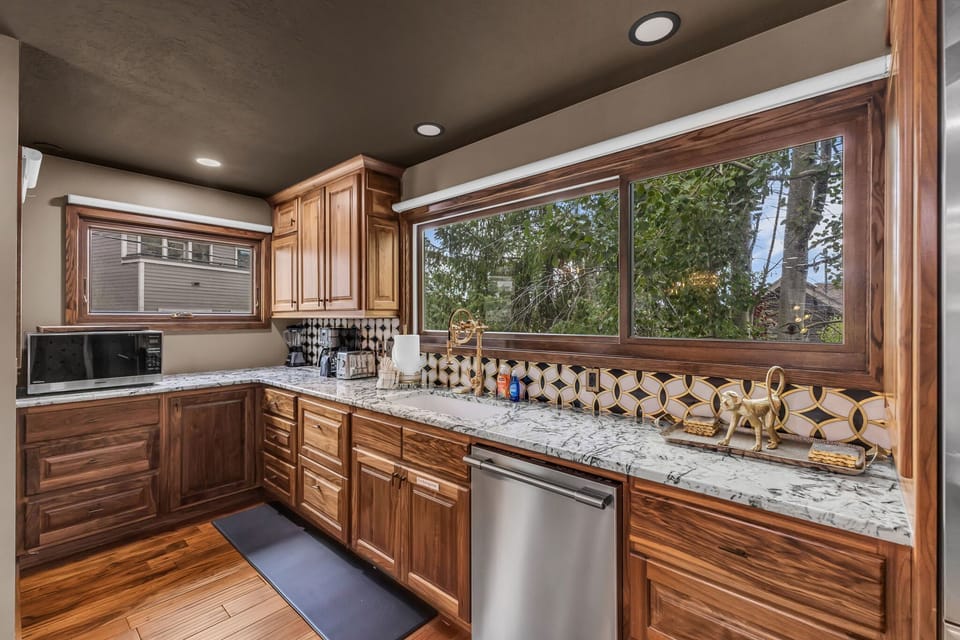 Kitchen: Main floor, drip coffee maker, Keurig, toaster, cooking utensils, tableware