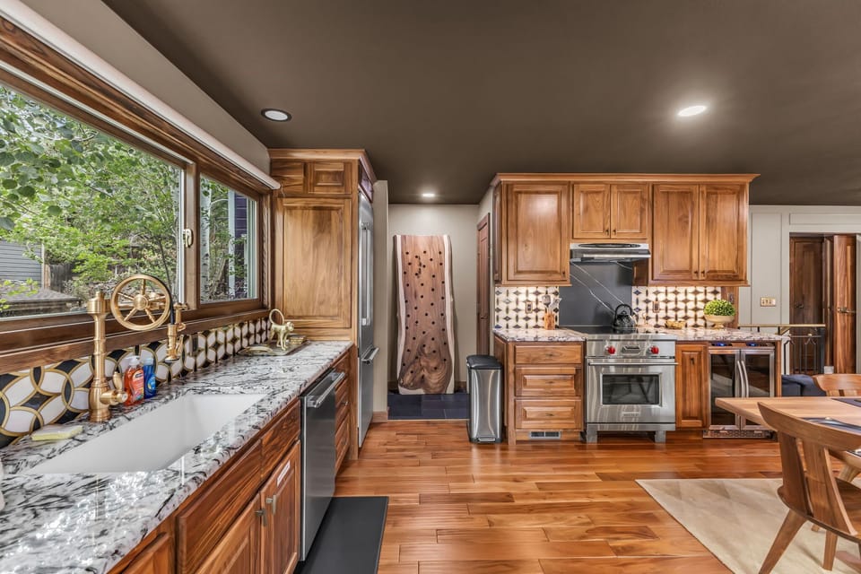 Kitchen: Main floor, drip coffee maker, Keurig, toaster, cooking utensils, tableware