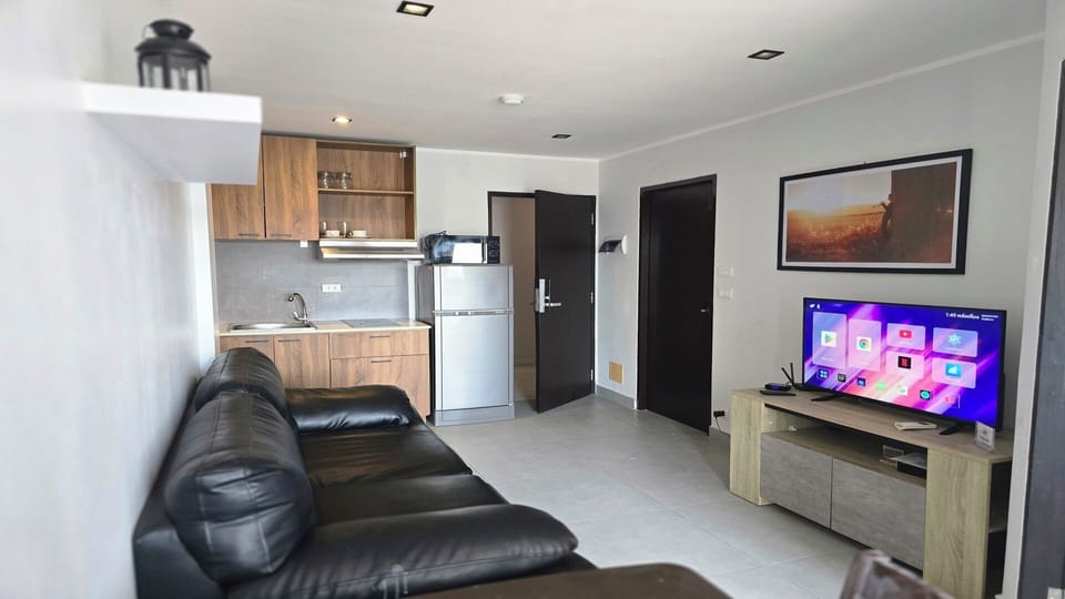 Apartment, Balcony, City View | Living area | Flat-screen TV