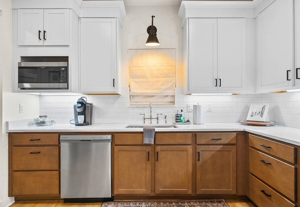 Modern kitchen setup with stylish cabinetry and convenient coffee nook.
