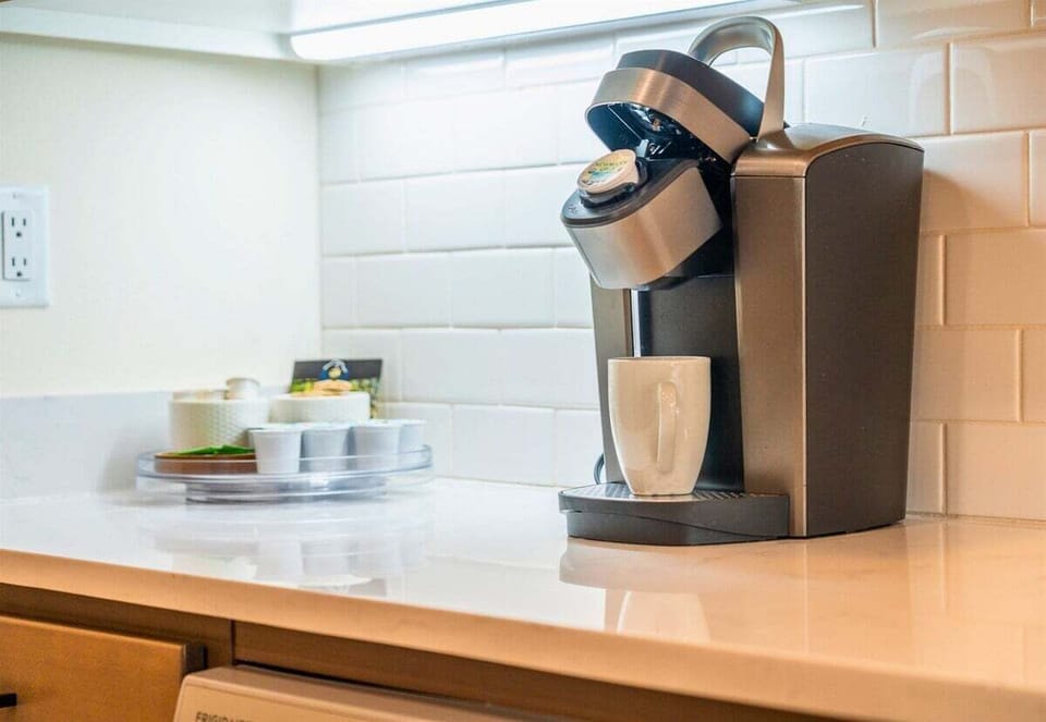 Start your morning right at the coffee station featuring a Keurig and essentials.