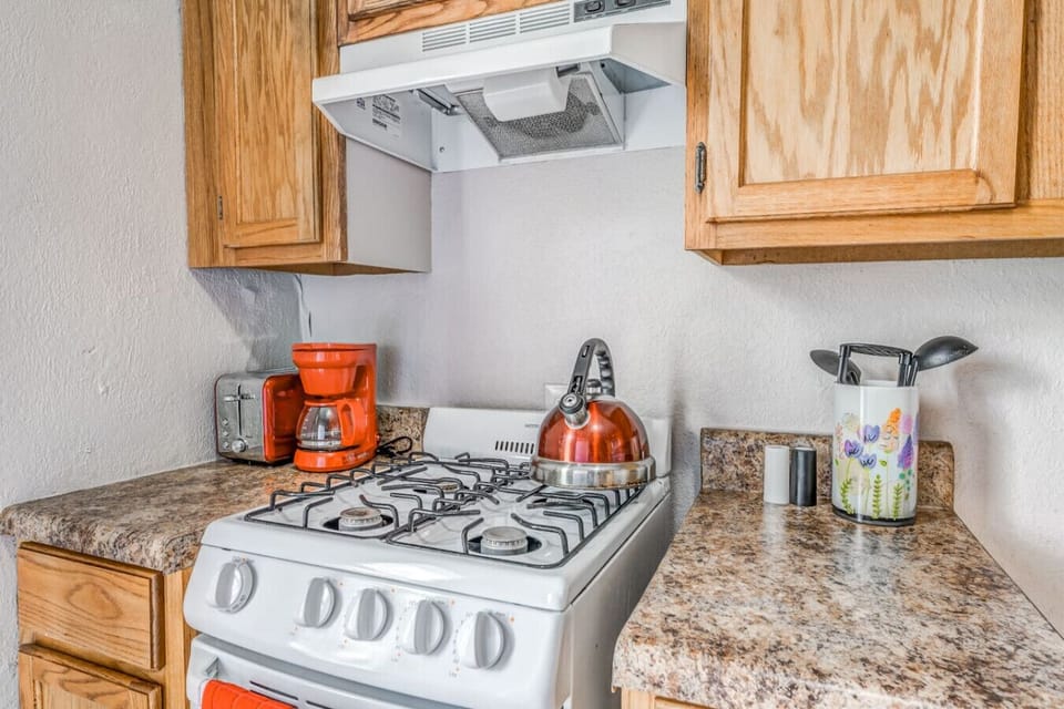 Brew coffee or tea while preparing meals on the gas range.