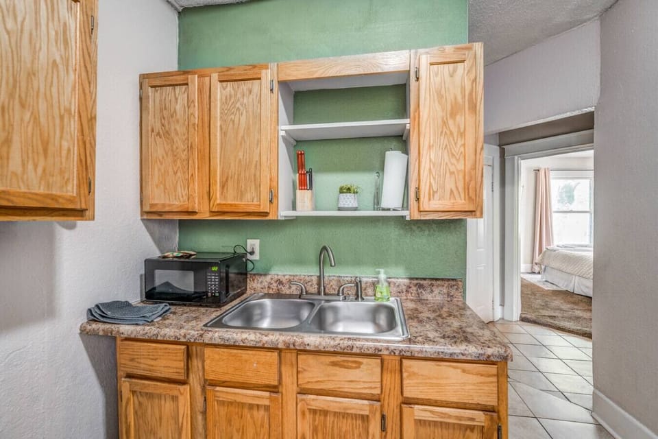Prepare meals with ease and gather in the adjoining rooms to enjoy them.