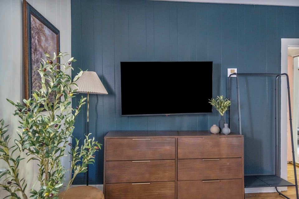 From serene slumber to captivating cinema! This bedroom is designed for ultimate comfort and entertainment. Kick off your shoes, grab a snack, and let the good times roll. Plus, with stylish storage, you'll feel right at home.