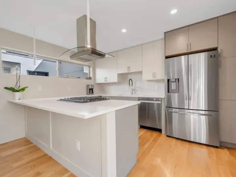 Cooking made easy in a fully equipped kitchen with sleek stainless-steel appliances and plenty of counter space.