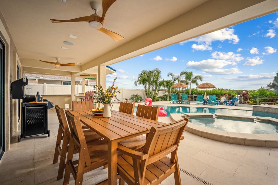 Outdoor: Sizzle, sip, and sit a while, poolside dining, island style.”