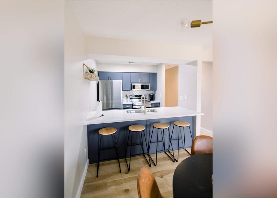 Sip morning coffee or grab a bite at the kitchen counter, with space for 4​