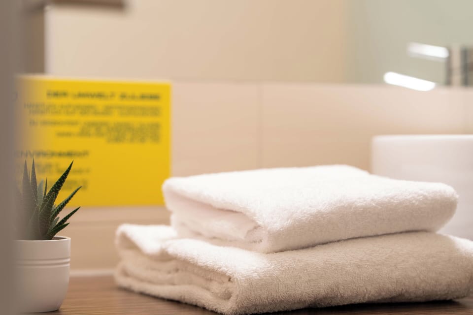 Hair dryer, towels, soap, shampoo