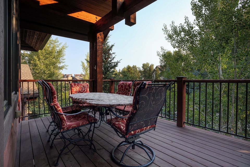 Relax on your private deck with comfortable seating and beautiful treetop views.