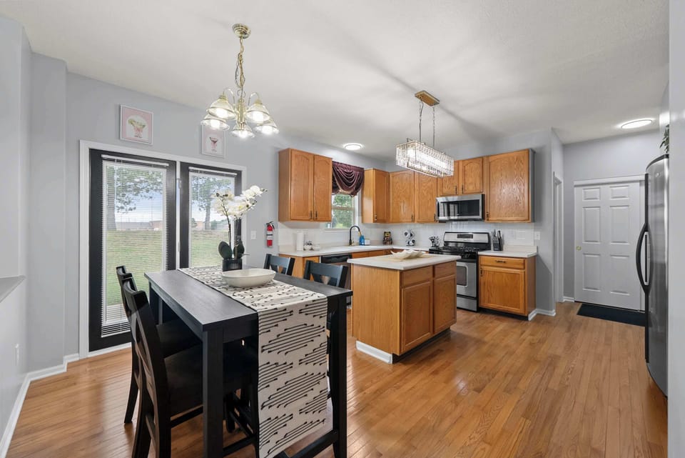 Sip morning coffee or grab a bite at the kitchen table, with space for 4​