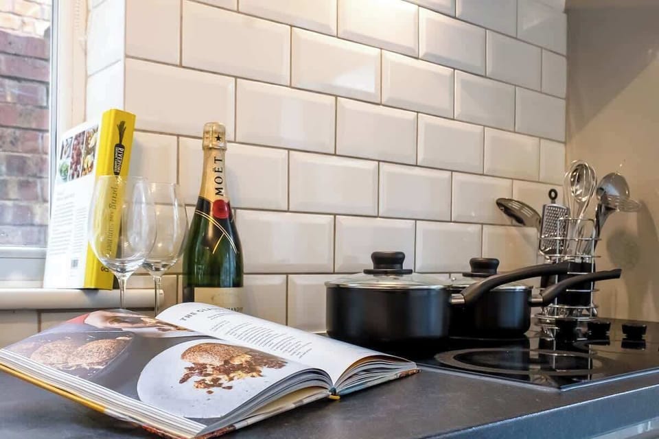 “Full kitchen with a simple dining area — everything you need for home-cooked meals and shared dining moments.”