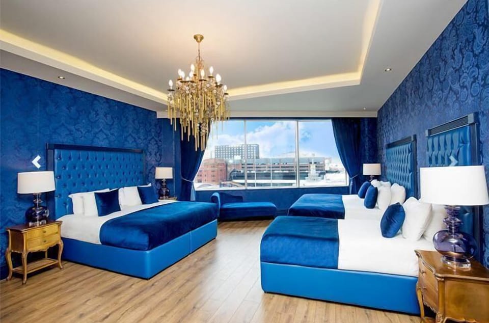 Deluxe Room | Premium bedding, in-room safe, desk, iron/ironing board