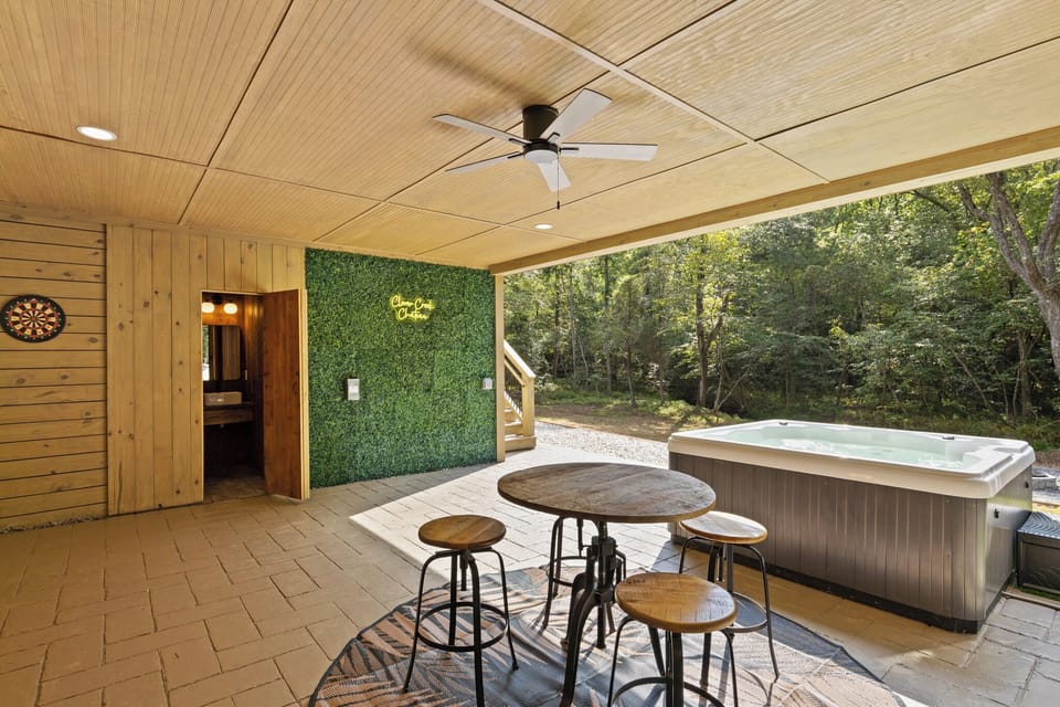 Open Porch with hot tub lookin toward creek