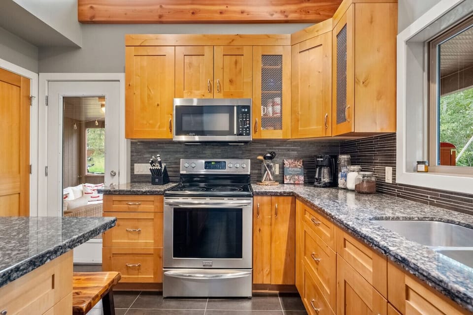 Full kitchen with drip & Keurig coffee makers, blender, Insta Pot, and essentials (ground coffee, tea, sugar, ketchup, mustard & relish.)