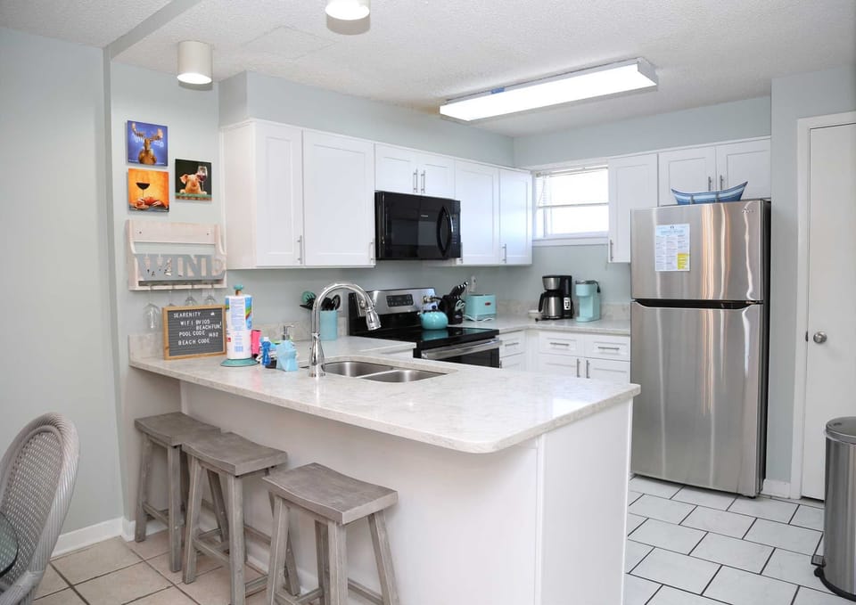 The fully equipped kitchen is stocked with everything you need to whip up home-cooked meals.