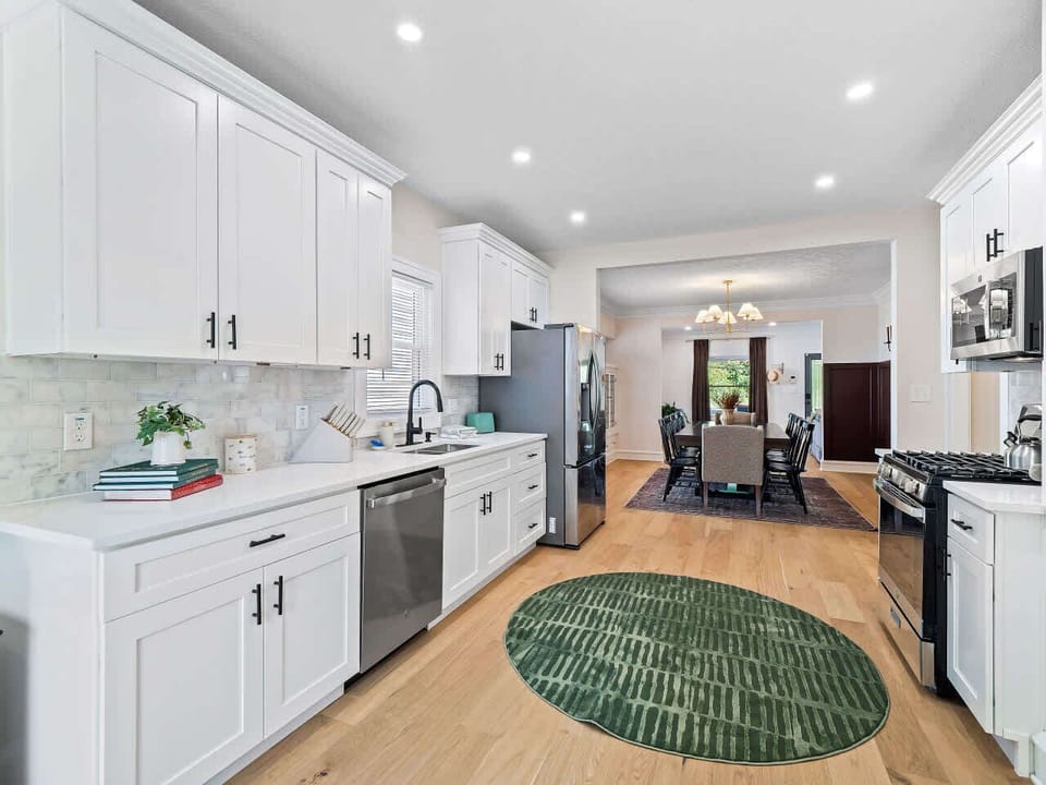 Bright kitchen w/ clean lines, generous counters, & stainless appliances ready for home cooking.