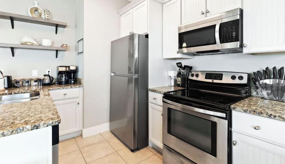 Fully equipped kitchen with stainless appliances and granite counters
