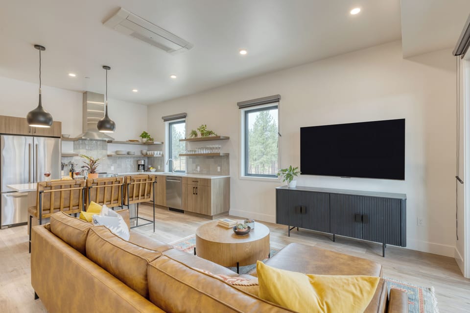 Bright living room with flat-screen TV.