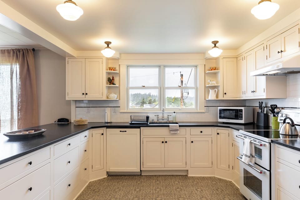 Indulge in the elegance of our kitchen, complete with updated and modern appliances.