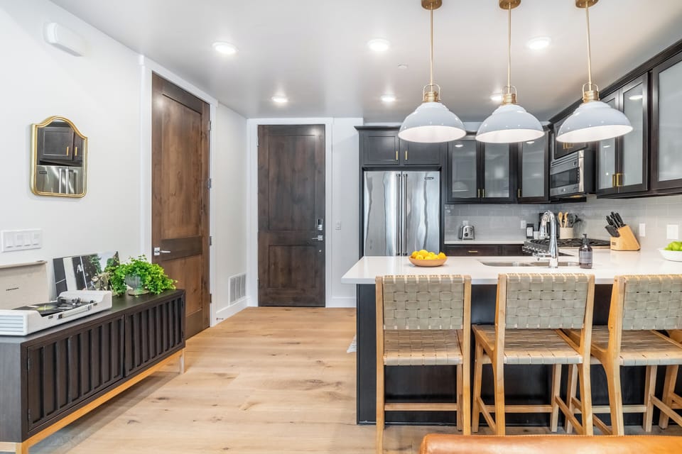 Modern kitchen with barstool seating.