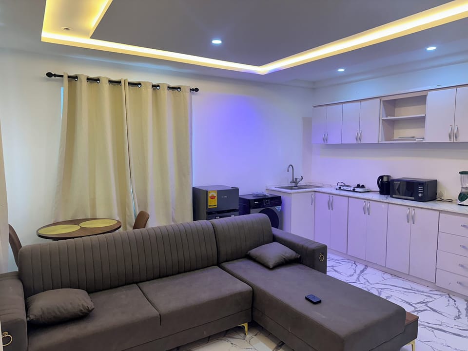 Luxury Apartment, Balcony, City View | Living area | 50-inch Smart TV with digital channels