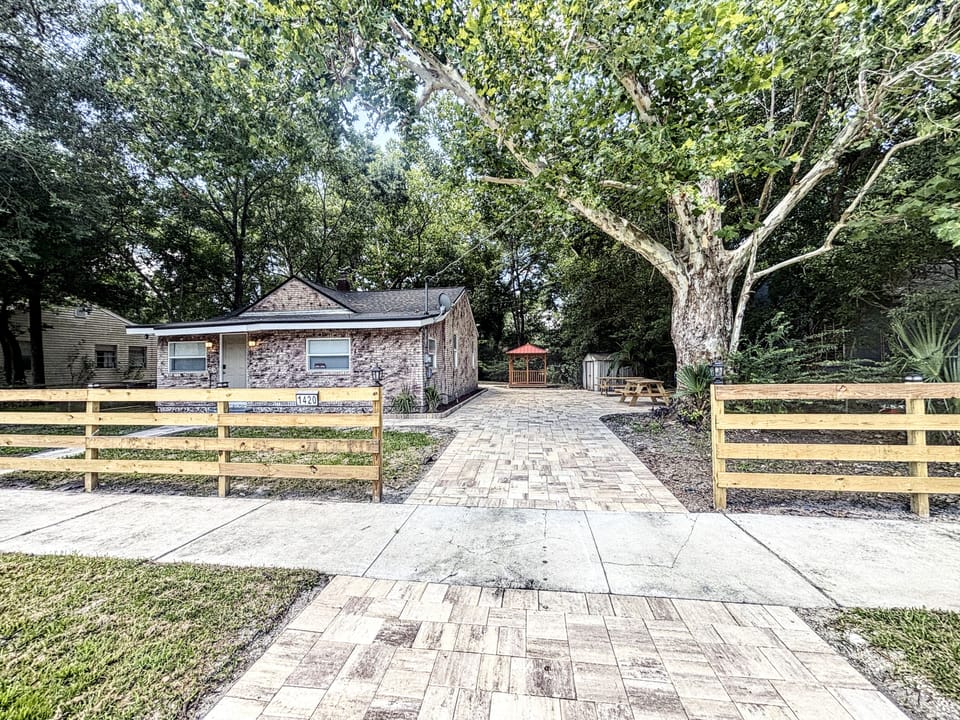 Cozy three-bedroom home with newly paved driveway and farm fence