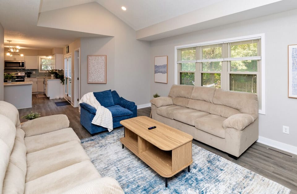 Living Area with 65` Smart tv, 2 couches and oversized chairM