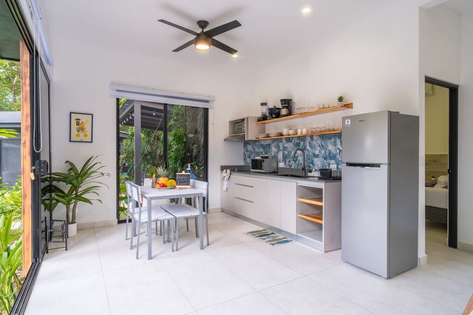 Fully equipped modern kitchen with tropical views and minimalist design in Playa Chiquita, Costa Rica