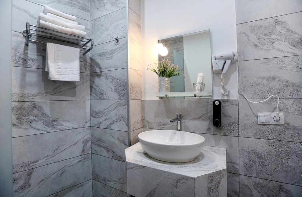 Shower, hair dryer, slippers, towels
