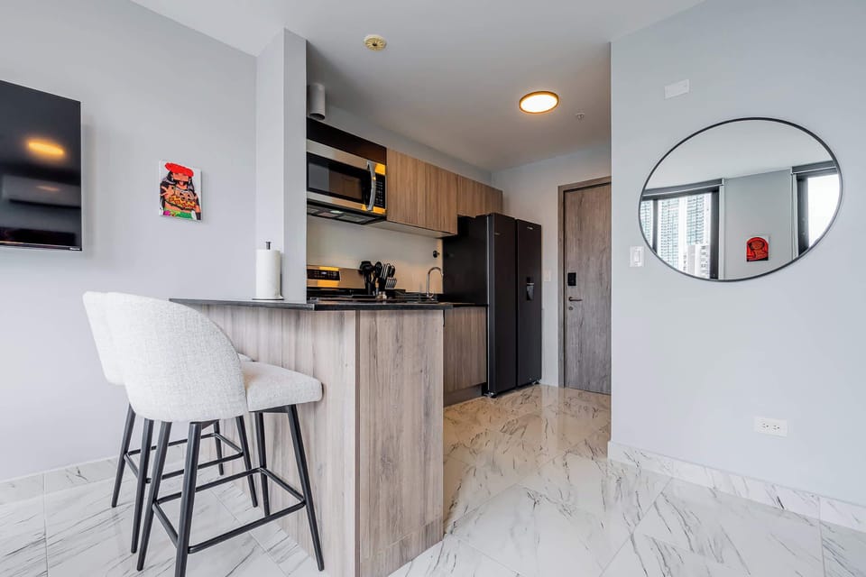 Spacious kitchen with a sleek breakfast counter.
