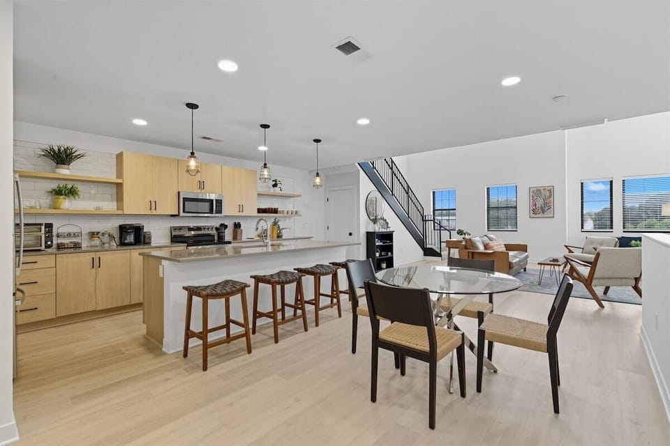 Enjoy a spacious kitchen that flows seamlessly into the living and dining areas—perfect for entertaining during your North Kansas City getaway.