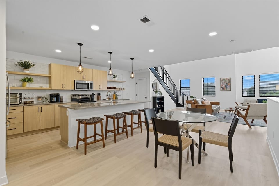 Enjoy a spacious kitchen that flows seamlessly into the living and dining areas—perfect for entertaining during your North Kansas City getaway.