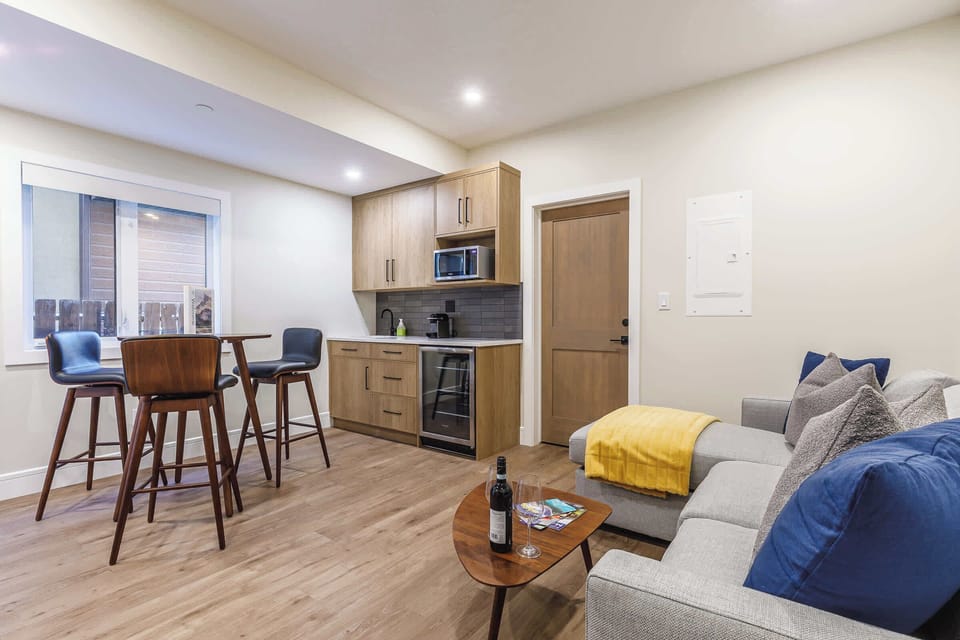 The downstairs suite offers a private entry, brand new sectional sofabed, TV, kitchenette, dining for 4, a laundry, bathroom and queen bedroom.