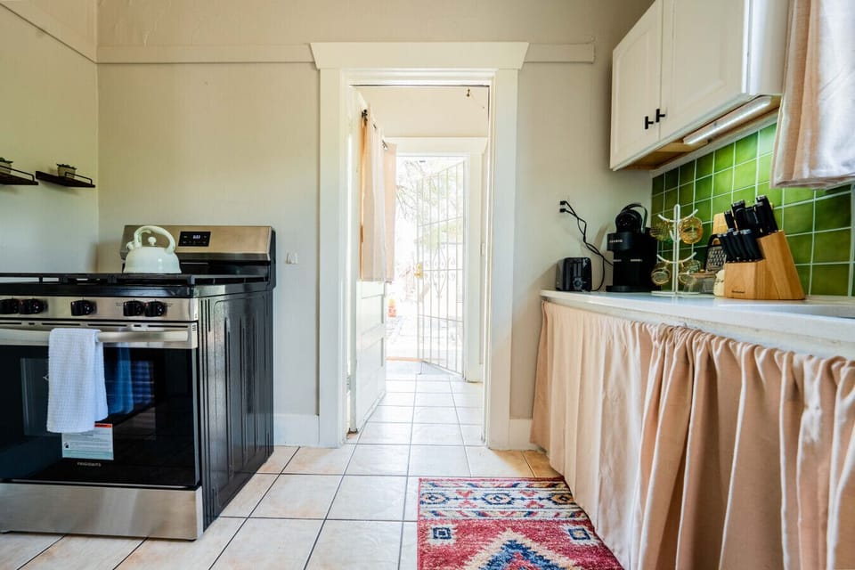 Whip up culinary delights in this charming space with vibrant tiles and modern appliances!