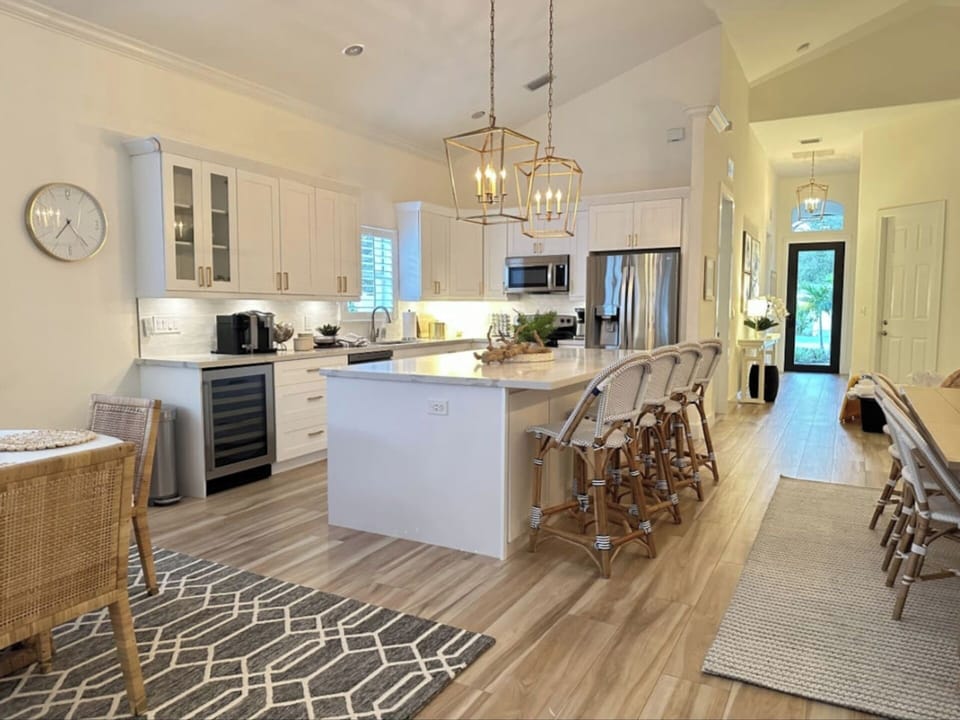 Fully Stocked Kitchen w/ Bar Seating and Two Tables!
