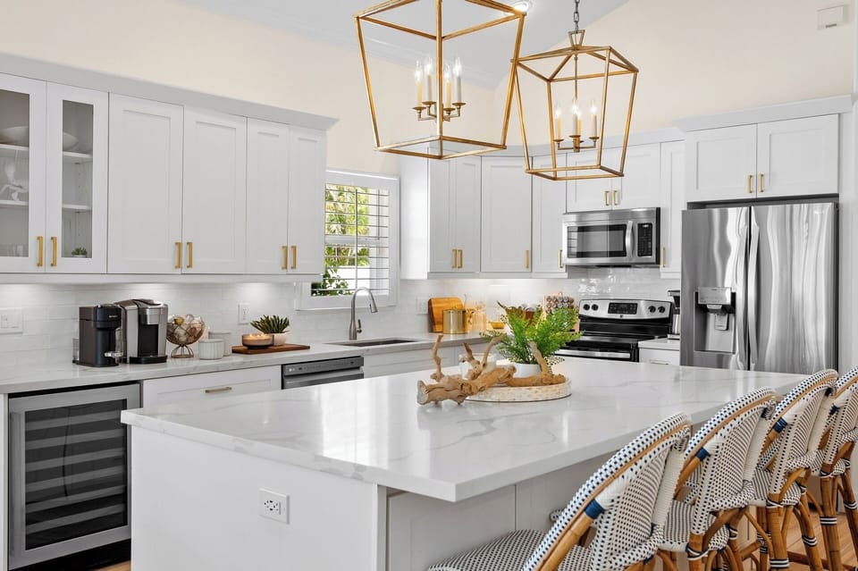 Fully Stocked Kitchen w/ Bar Seating and Two Tables!