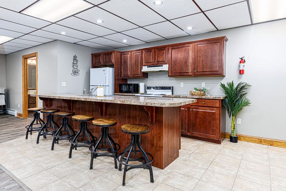 Basement kitchenette and bar with seating