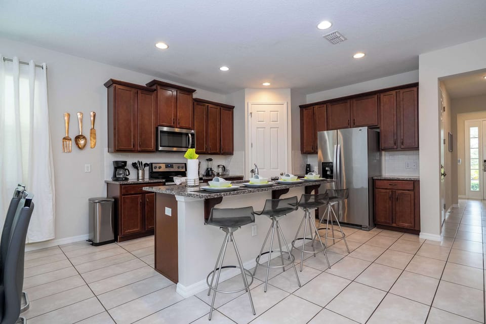 Cook up a feast in this fully equipped kitchen with sleek granite counters, stainless steel appliances, and a breakfast bar for casual dining!