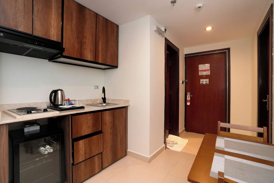 Mini-fridge, electric kettle, cleaning supplies