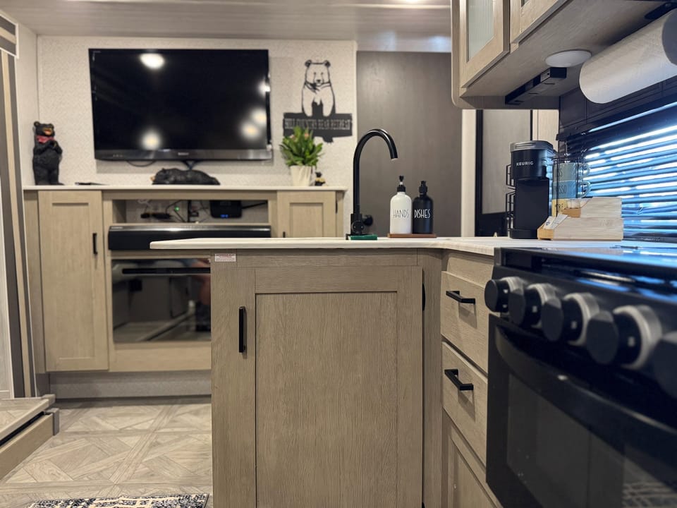 Bears Den view into the kitchen and living room — where cozy corners meet shared spaces.