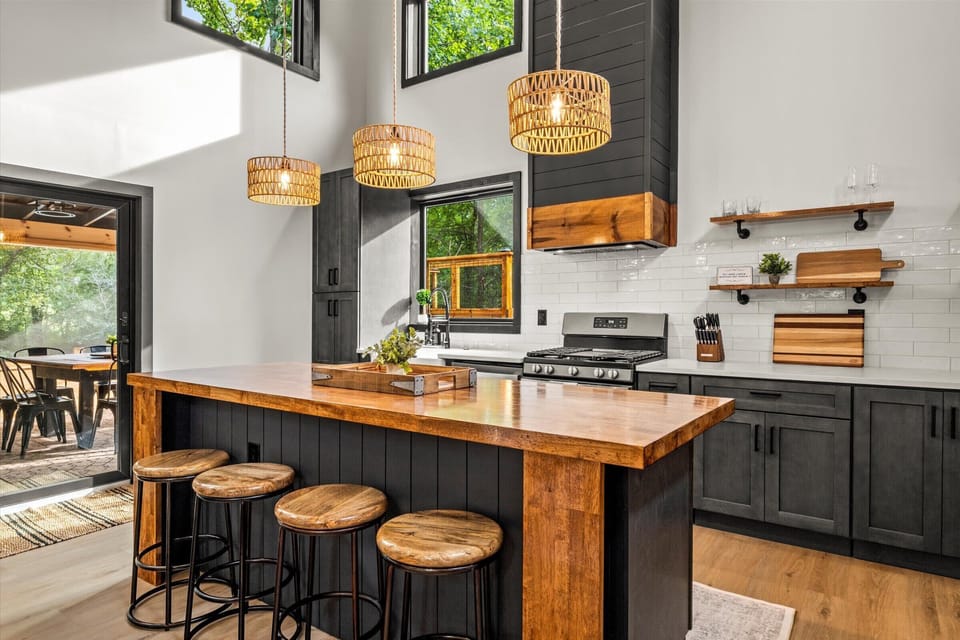 Woven-shade pendants cast warmth and texture over the island.