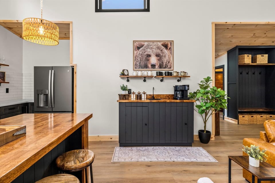 Elegant coffee corner where wood warmth meets sleek black design.