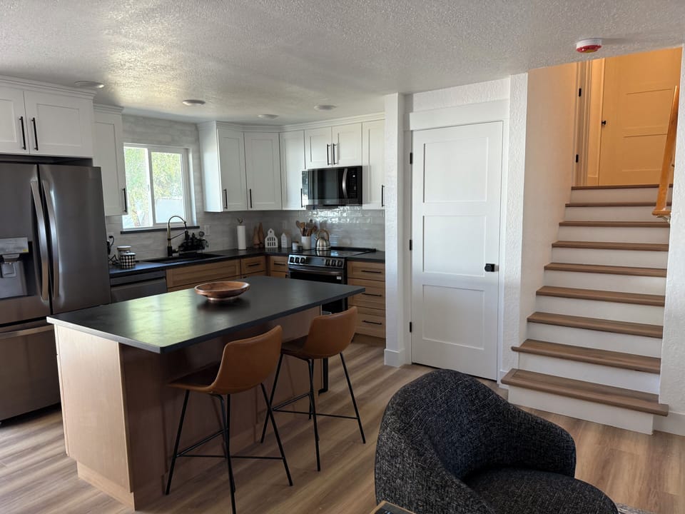 Granite and tile, new appliances induction cooktop, air fryer, stairs to bedroom