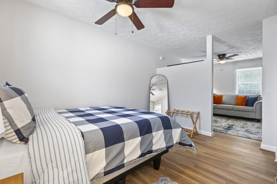 Comfortable queen bed with fresh linens for a restful stay.