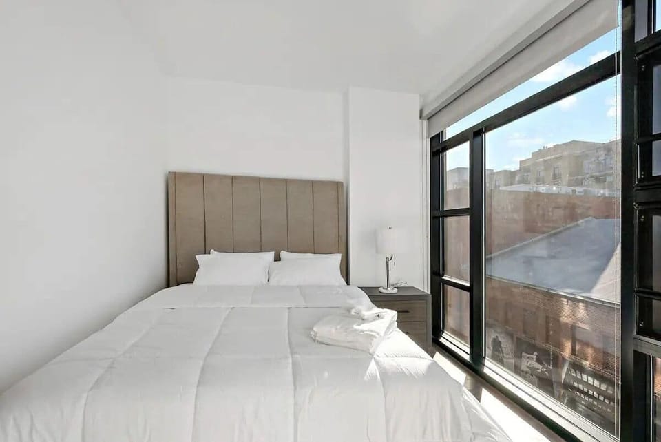 Second queen bedroom with natural light