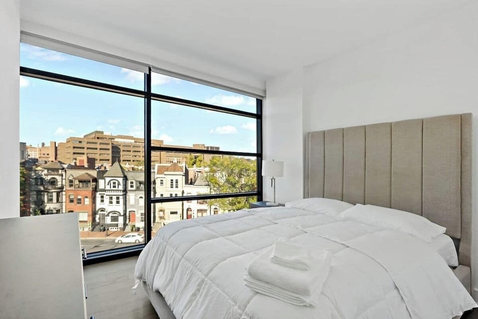 Queen bedroom with city views