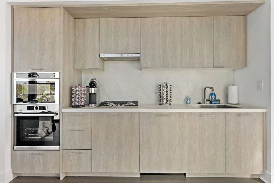 Full kitchen with oven, stovetop, microwave and coffee station