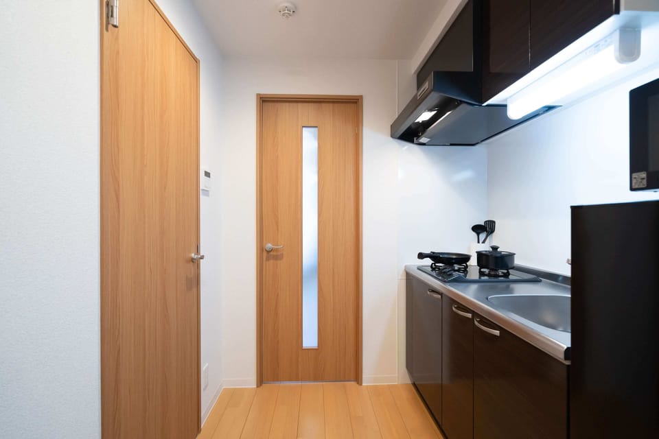 Family Room, Balcony, City View | Pillowtop beds, laptop workspace, blackout drapes, iron/ironing board